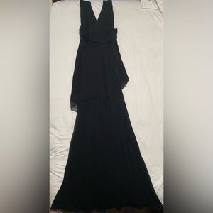 Vintage Jackie Roger size six 100% Silk black dress.
